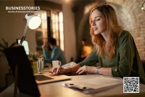 Woman working on laptop at desk creating content strategy, representing multiple stories approach for powerful content creation and blogging success. 