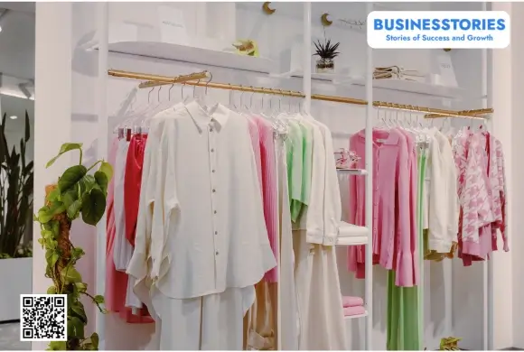 Modern clothing store displaying stylish apparel for entrepreneurs learning how to start a clothing business.