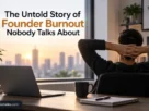 Founder burnout in a modern workspace with a laptop and city skyline